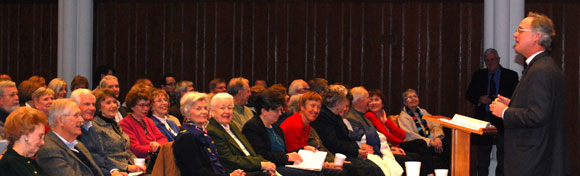 Sam Candler speaks to crowd in Child Hall